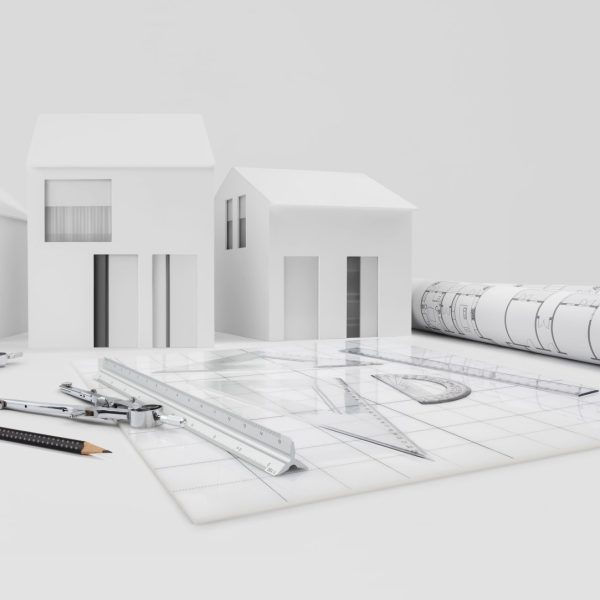 Architectural,Model,Of,Houses,On,Desk,With,Drawing,Technical,Tools